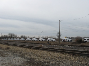 Fourteen St. Louis County Police vehicles along Route 3 outside the port